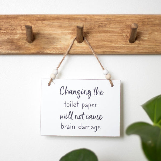 "Changing The Toilet Paper" Hanging Sign